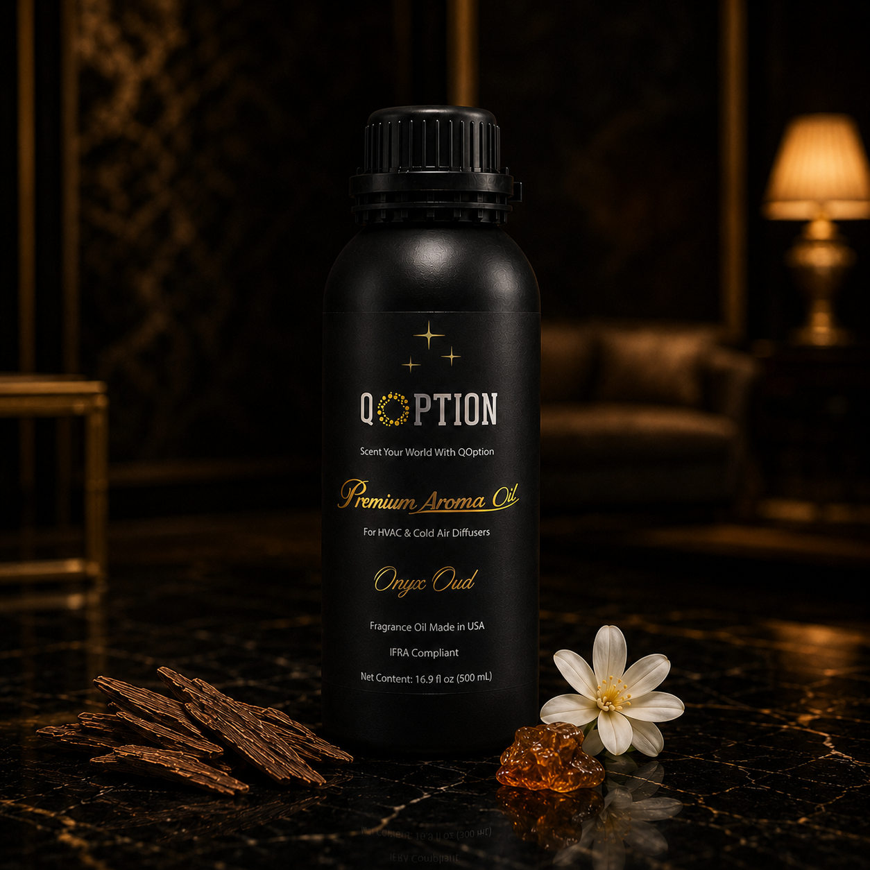 Black bottle of Qoption premium aroma oil with a white flower and brown leaves on a dark surface.