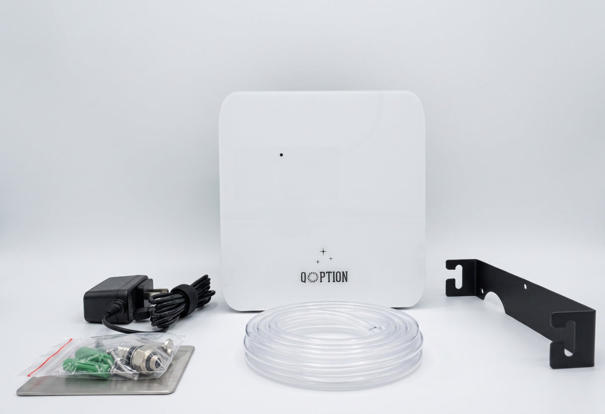 QOption Essence QX300 white cold-air HVAC scent diffuser machine with included ducting hose, power adapter, and mount.