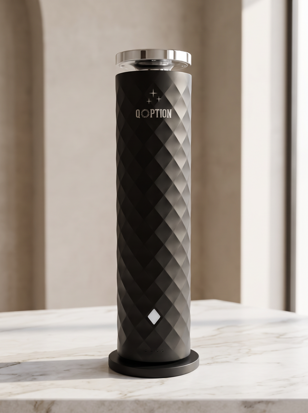 QOption Essence QPD10 portable black cold-air scent diffuser with a textured geometric design on a marble surface.