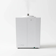 QOption Essence QA1000 Pro commercial HVAC scent diffuser in white metal with a fine mist output on a white background