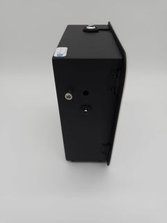 QOption Essence QX300 luxury black HVAC scent diffuser machine, side view showing power port and metal casing.