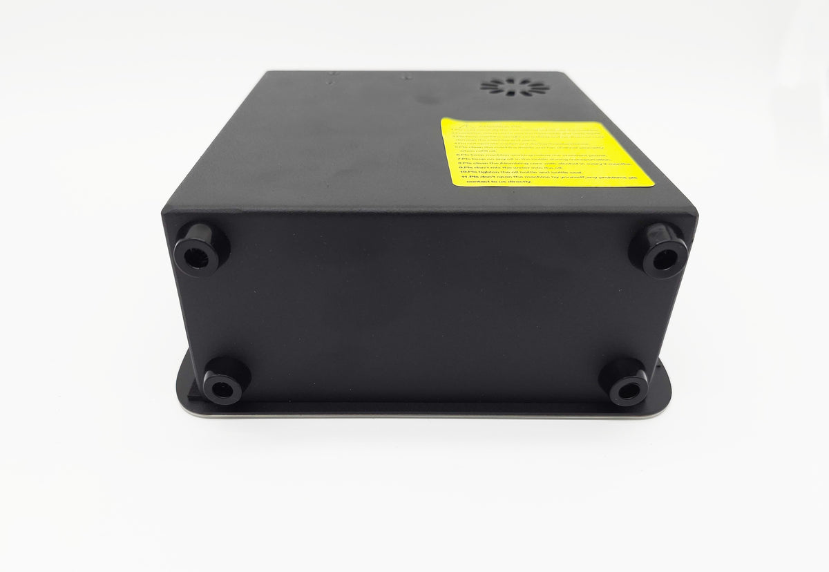 QOption Essence QX300 luxury HVAC scent diffuser machine base with rubber feet and yellow safety warning label