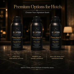 QOption Essence signature aroma oil bottles in Emerald Drift, Own Style, and Onyx Oud scents for HVAC diffusers.